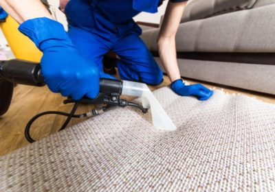 Cleaning,Service.,Man,Janitor,In,Gloves,And,Uniform,Vacuum,Clean
