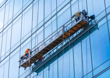 Professional,High,Rise,Window,Cleaning,Service,Workers,In,Gondola.,Two