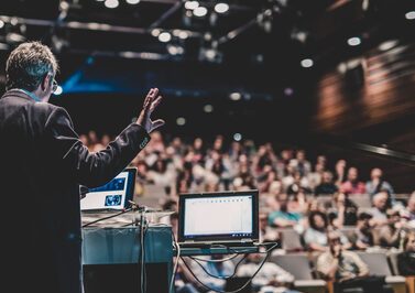 Public,Speaker,Giving,Talk,At,Business,Event.